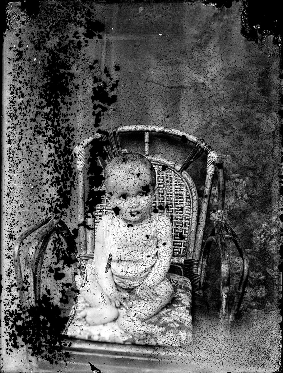 Crazed emulsion across a studio portrait